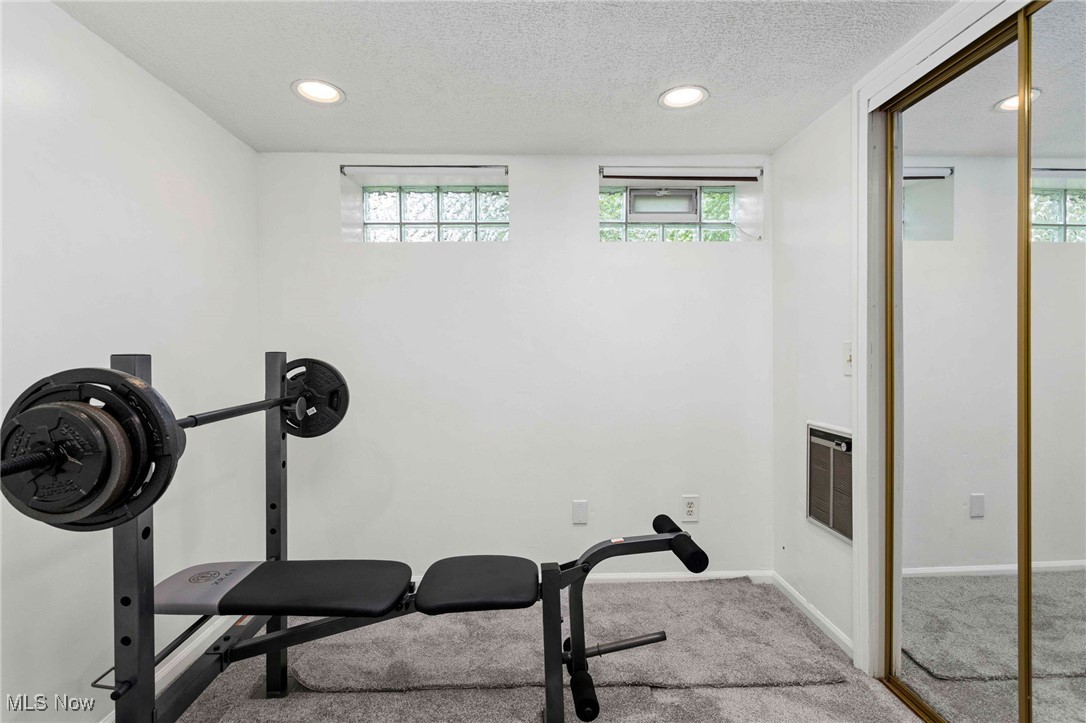 22250 Mastick Road Cleveland, OH 44126 - Photo 31 of 40 Exercise area featuring a textured ceiling, carpet, recessed lighting, and heating unit