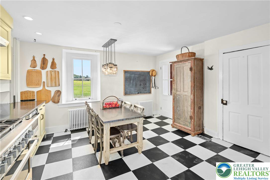 119 Center Hill Road Upper Black Eddy, PA 18972 - Photo 16 of 63 a room with a black white checkered floor with white walls and a rug