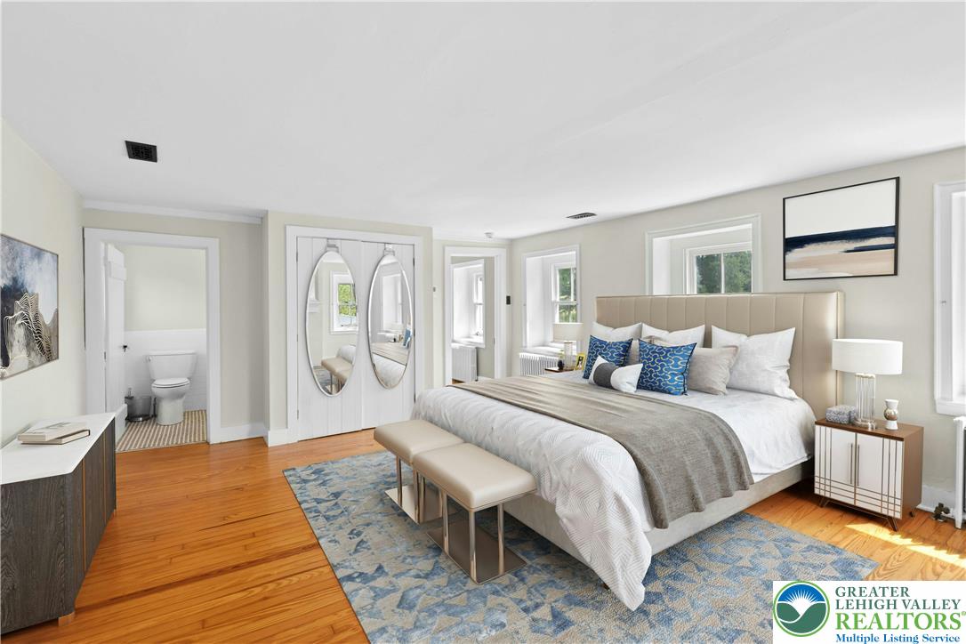 119 Center Hill Road Upper Black Eddy, PA 18972 - Photo 18 of 63 a spacious bedroom with a bed and glass window