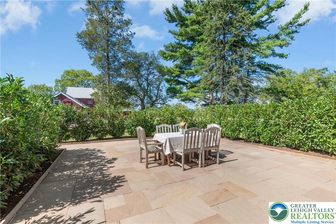 119 Center Hill Road Upper Black Eddy, PA 18972 - Photo 22 of 63 a view of a chair and table in the backyard