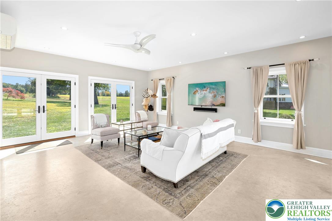 119 Center Hill Road Upper Black Eddy, PA 18972 - Photo 27 of 63 a living room with furniture and large windows