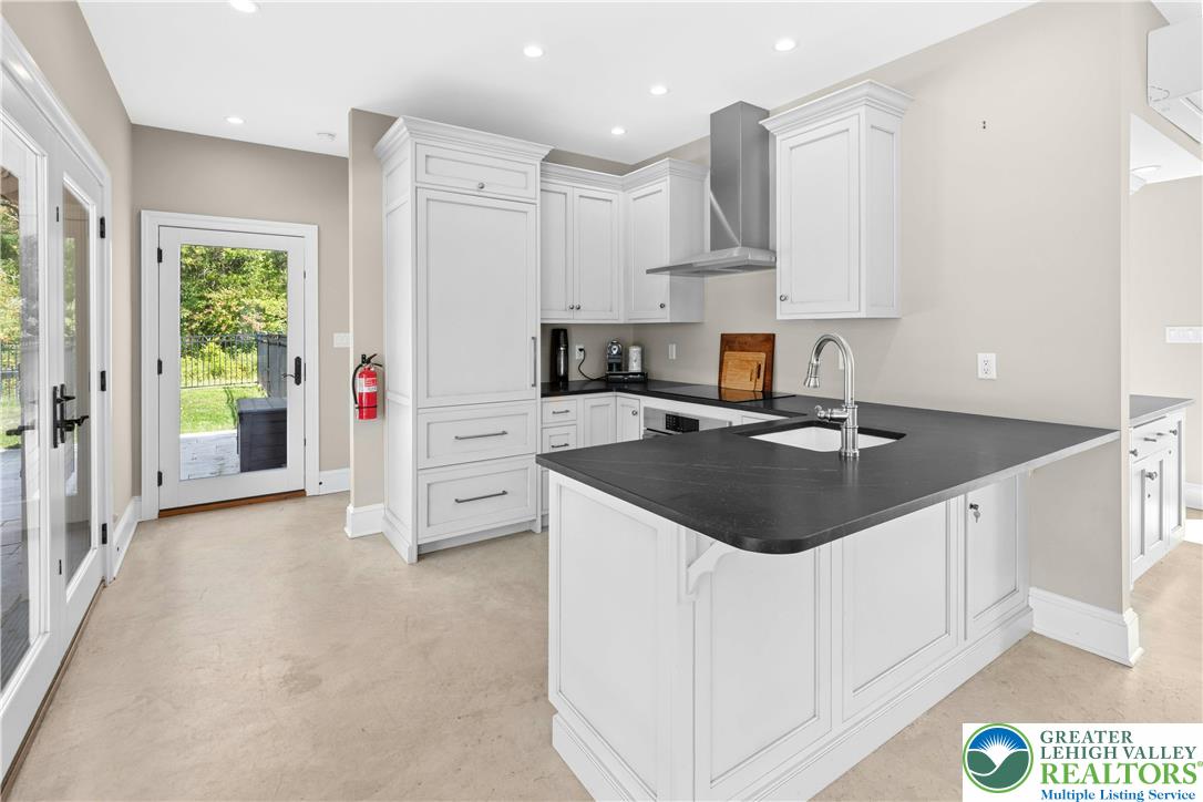 119 Center Hill Road Upper Black Eddy, PA 18972 - Photo 29 of 63 a kitchen with stainless steel appliances granite countertop a sink stove and refrigerator