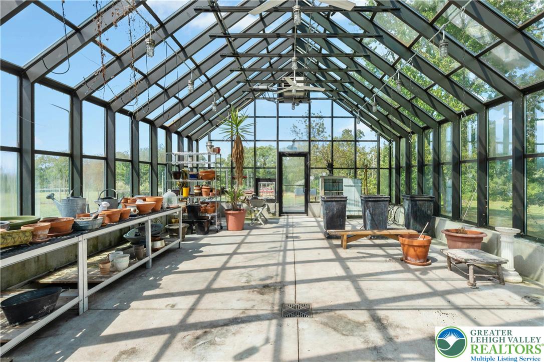 119 Center Hill Road Upper Black Eddy, PA 18972 - Photo 34 of 63 a room with lots of tables and large windows