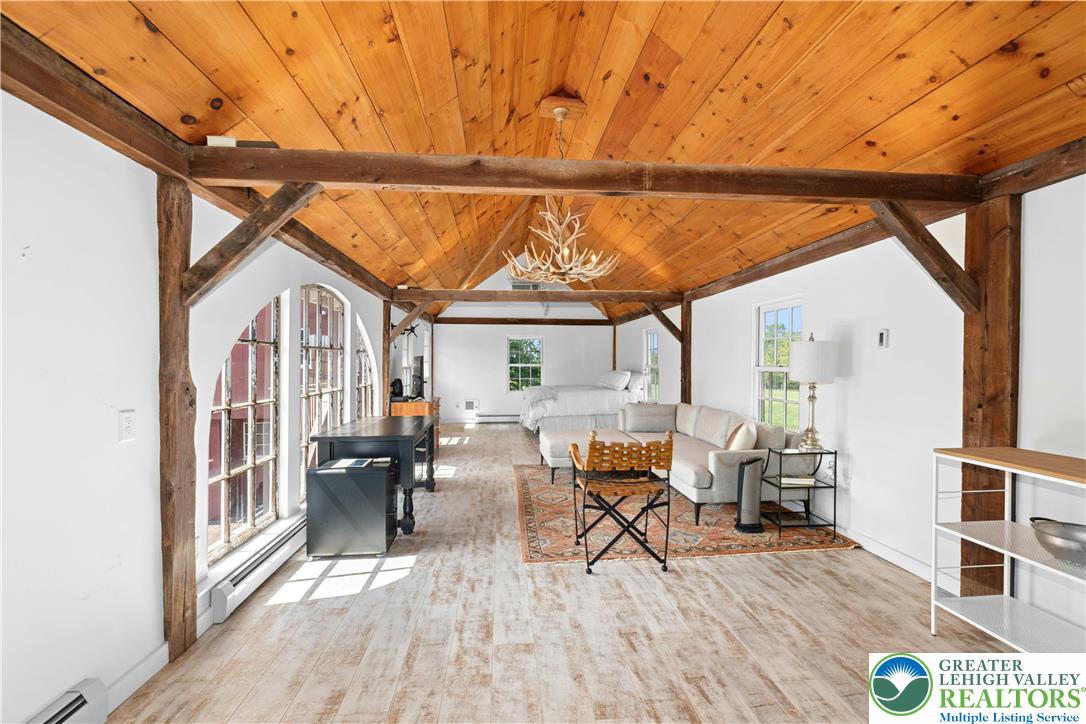 119 Center Hill Road Upper Black Eddy, PA 18972 - Photo 39 of 63 a dining room with wooden floor table and chairs