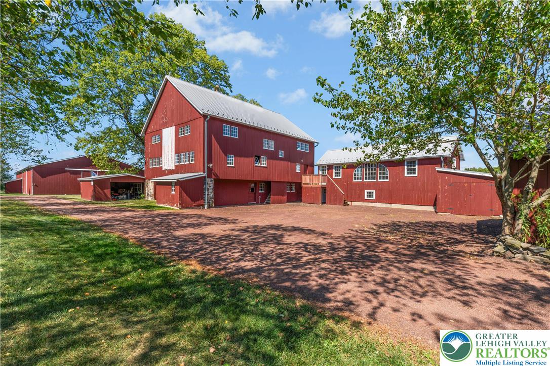 119 Center Hill Road Upper Black Eddy, PA 18972 - Photo 4 of 63 a front view of a house with a yard