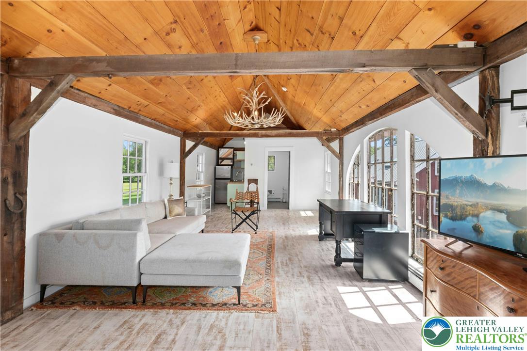 119 Center Hill Road Upper Black Eddy, PA 18972 - Photo 41 of 63 a living room with furniture and a painting on the wall