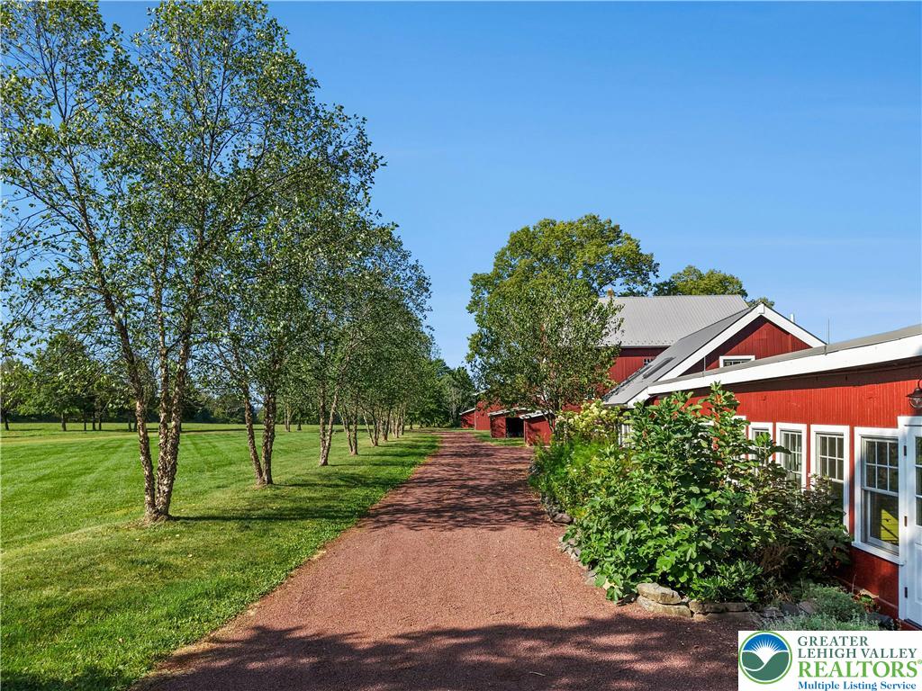 119 Center Hill Road Upper Black Eddy, PA 18972 - Photo 44 of 63 a backyard of a house with lots of green space and fountain