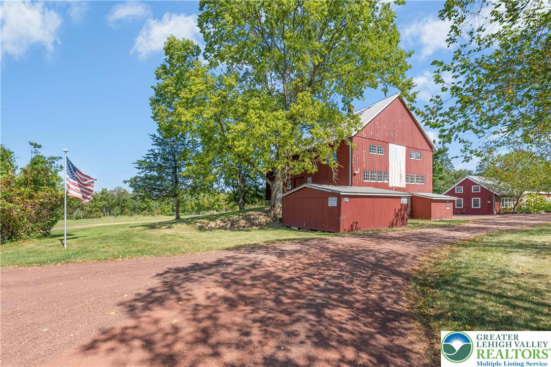 119 Center Hill Road Upper Black Eddy, PA 18972 - Photo 45 of 63 a view of big house with a big yard and large trees