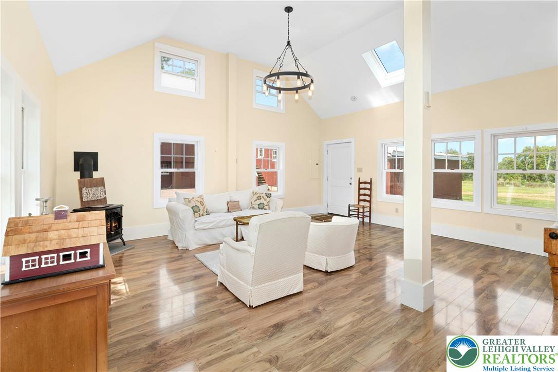 119 Center Hill Road Upper Black Eddy, PA 18972 - Photo 46 of 63 a living room with furniture a fireplace and a table