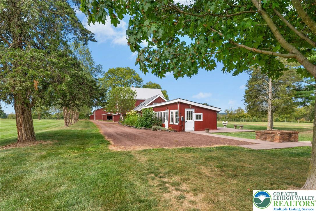 119 Center Hill Road Upper Black Eddy, PA 18972 - Photo 55 of 63 a front view of a house with garden
