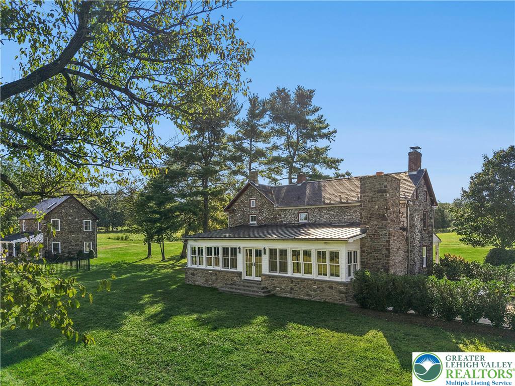 119 Center Hill Road Upper Black Eddy, PA 18972 - Photo 57 of 63 a front view of a house with garden