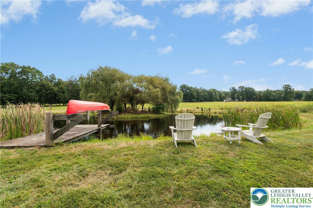 119 Center Hill Road Upper Black Eddy, PA 18972 - Photo 6 of 63 a view of a lake with houses in the back