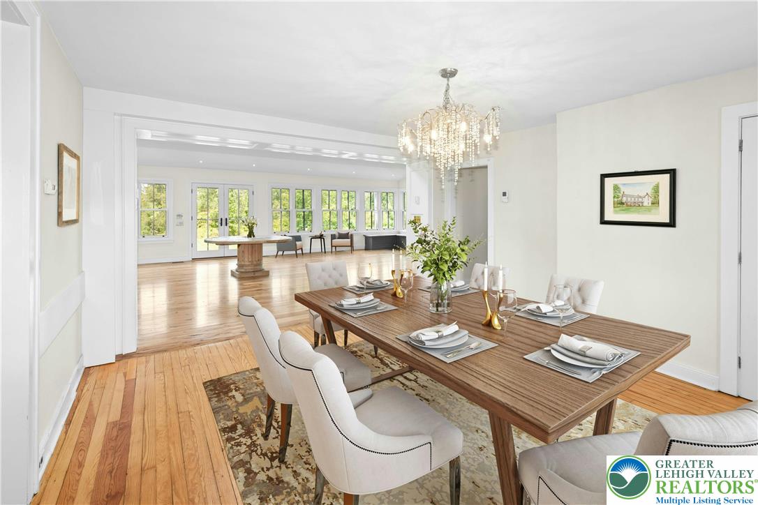 119 Center Hill Road Upper Black Eddy, PA 18972 - Photo 9 of 63 a view of a dining room with furniture a chandelier and wooden floor