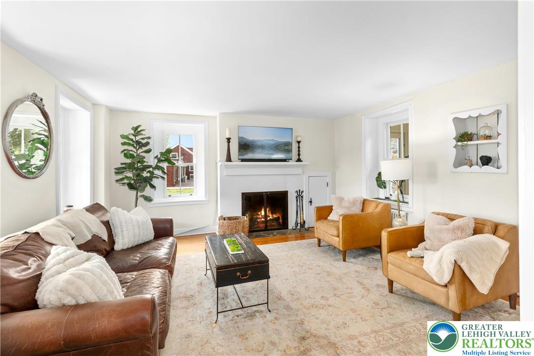 119 Center Hill Road Upper Black Eddy, PA 18972 - Photo 10 of 63 a living room with furniture and a fireplace