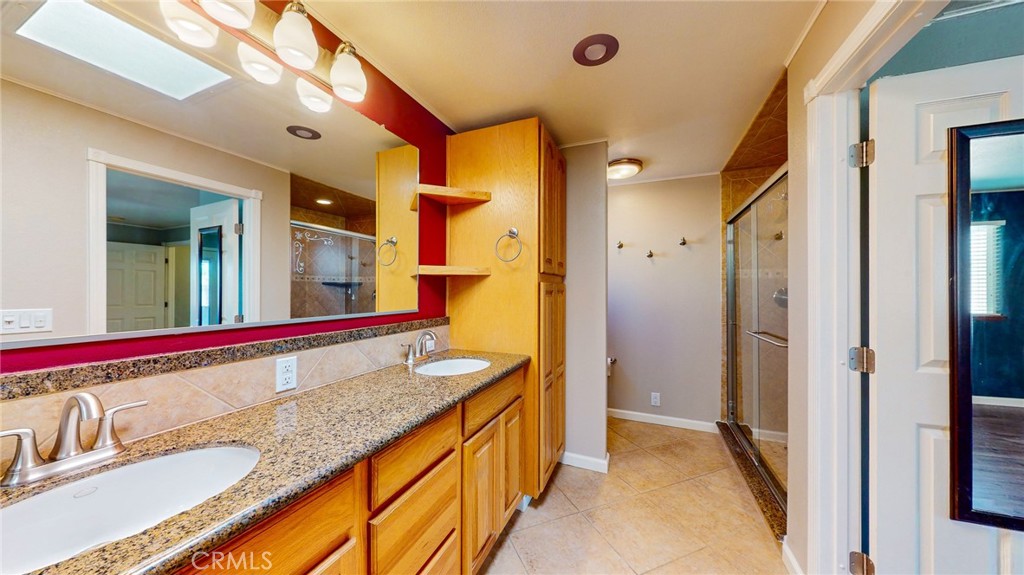 218 7th Street Orland, CA 95963 - Photo 19 of 38 Granite CT & plenty of cabinets primary bath