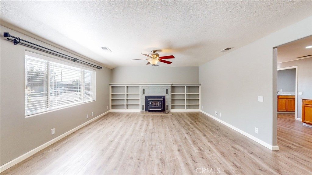 218 7th Street Orland, CA 95963 - Photo 5 of 38 Living Room, Woodstove, shelving, recessed lighting