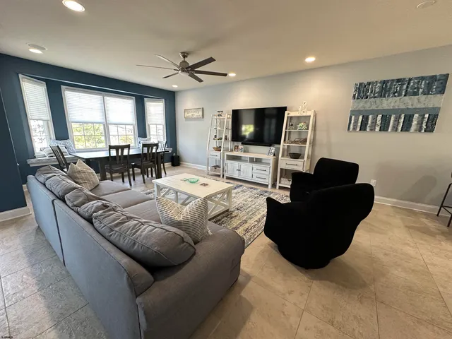 a living room with furniture or couch and a flat screen tv