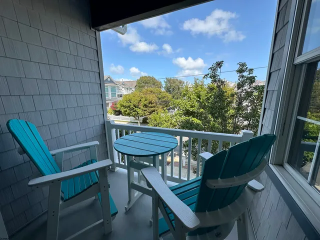 a view of a balcony with furniture
