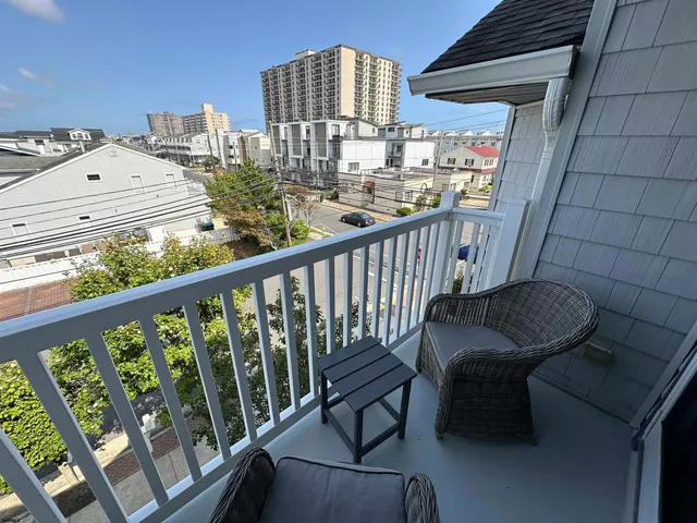 a view of balcony with furniture