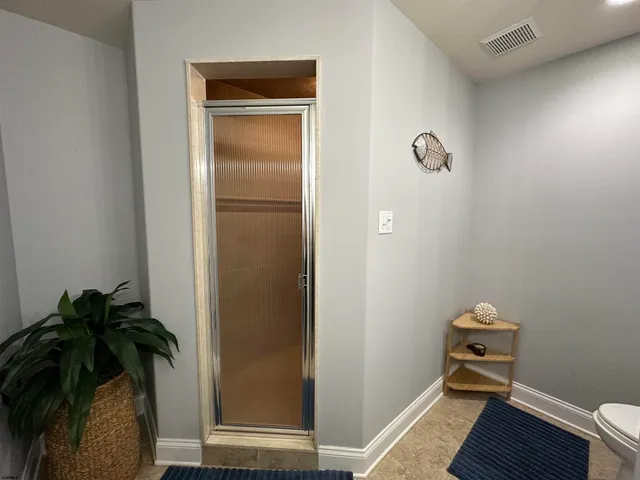 a view of a hallway to a bedroom