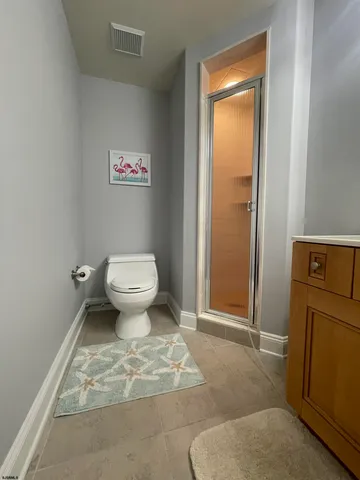 a bathroom with a toilet and a sink