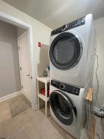 a utility room with sink dryer and washer