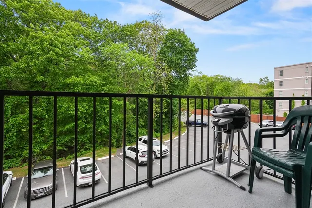 a view of a balcony with chairs