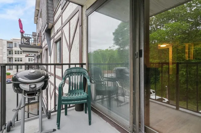 a view of a balcony with chairs