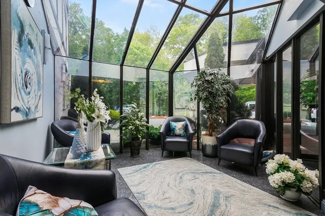 a living room with furniture and garden