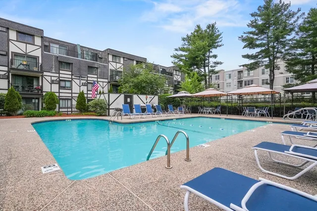 a view of a swimming pool with a patio