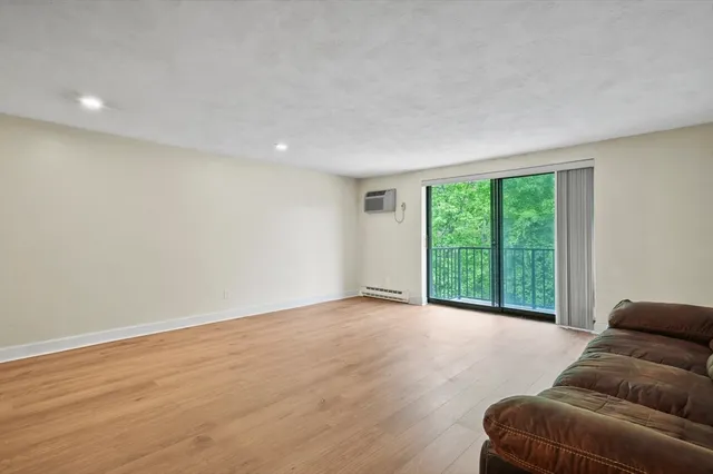a view of livingroom with furniture and wooden floor