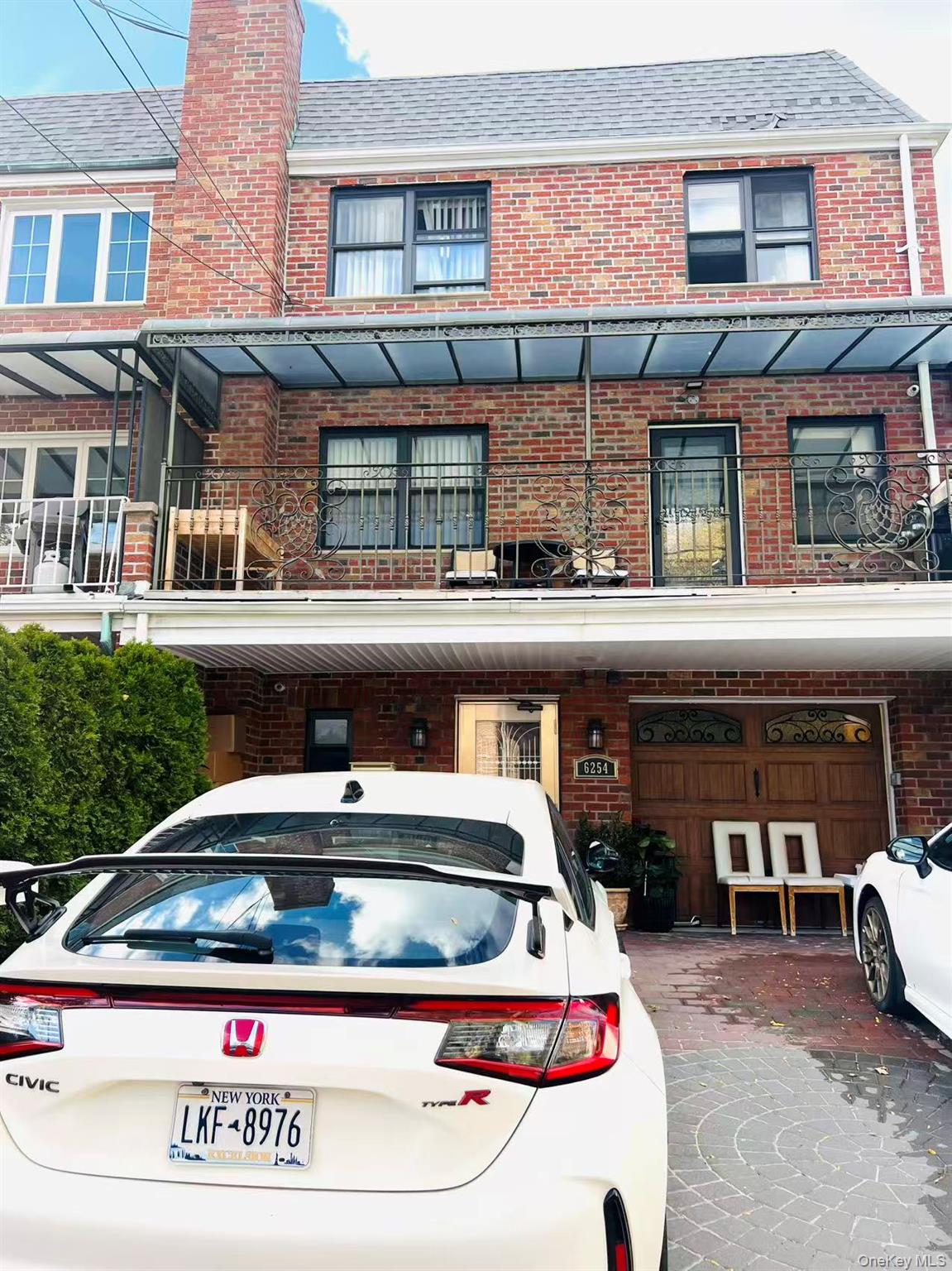 a view of building with car parked