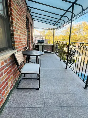 a balcony with furniture and outdoor view