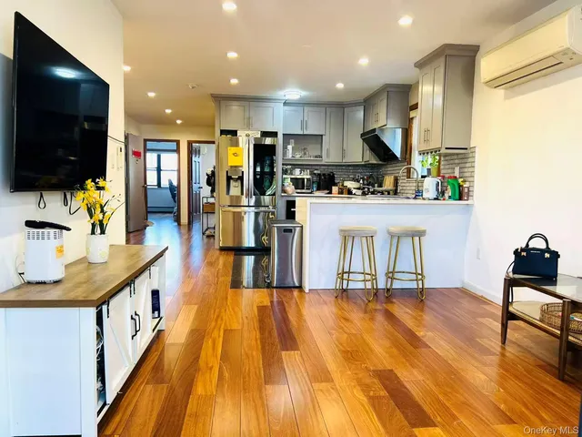 a kitchen with stainless steel appliances kitchen island granite countertop a sink and cabinets