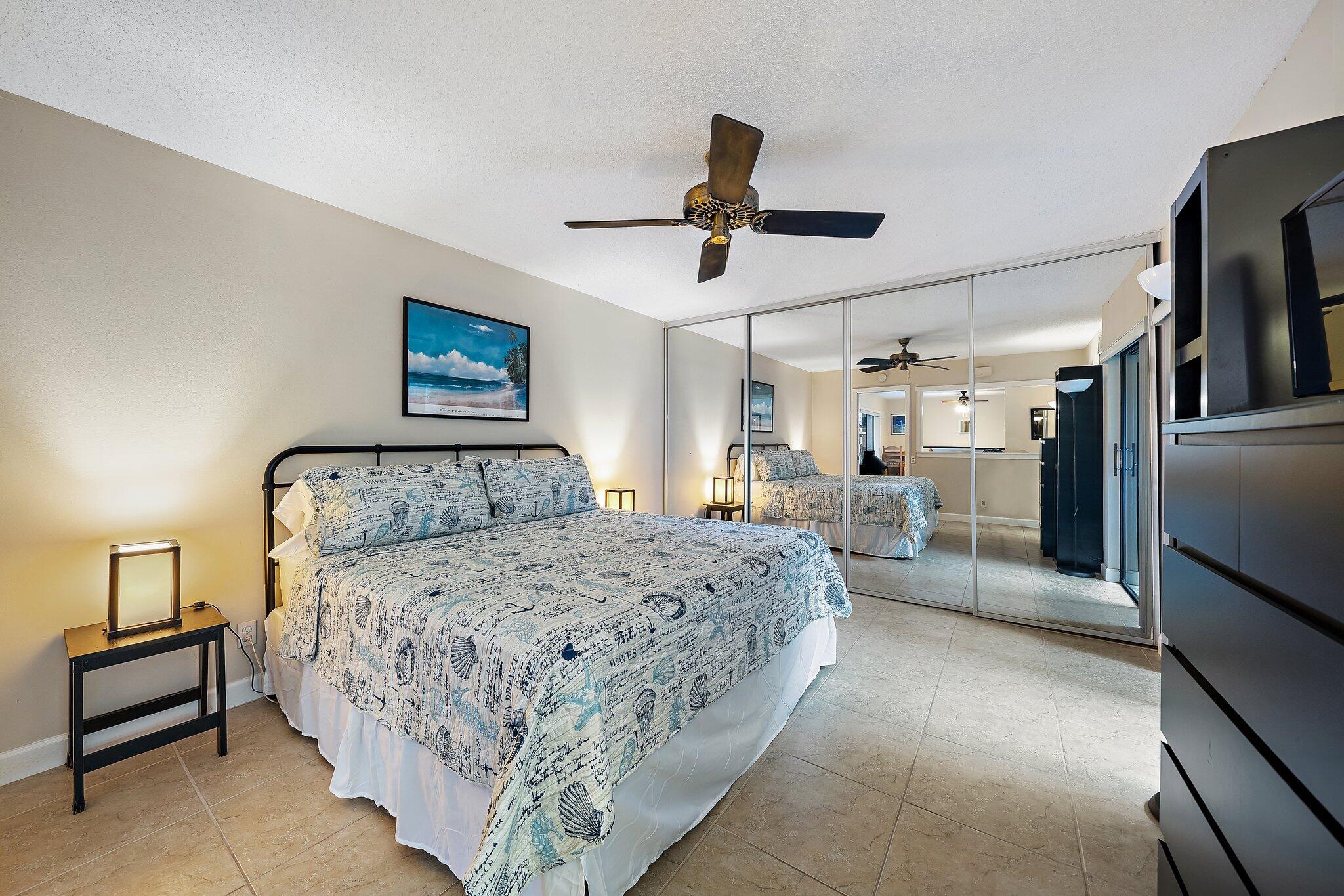 1605 Highway 1, Unit SL5A Jupiter, FL 33477 - Photo 15 of 26 a bed room with a bed and a ceiling fan