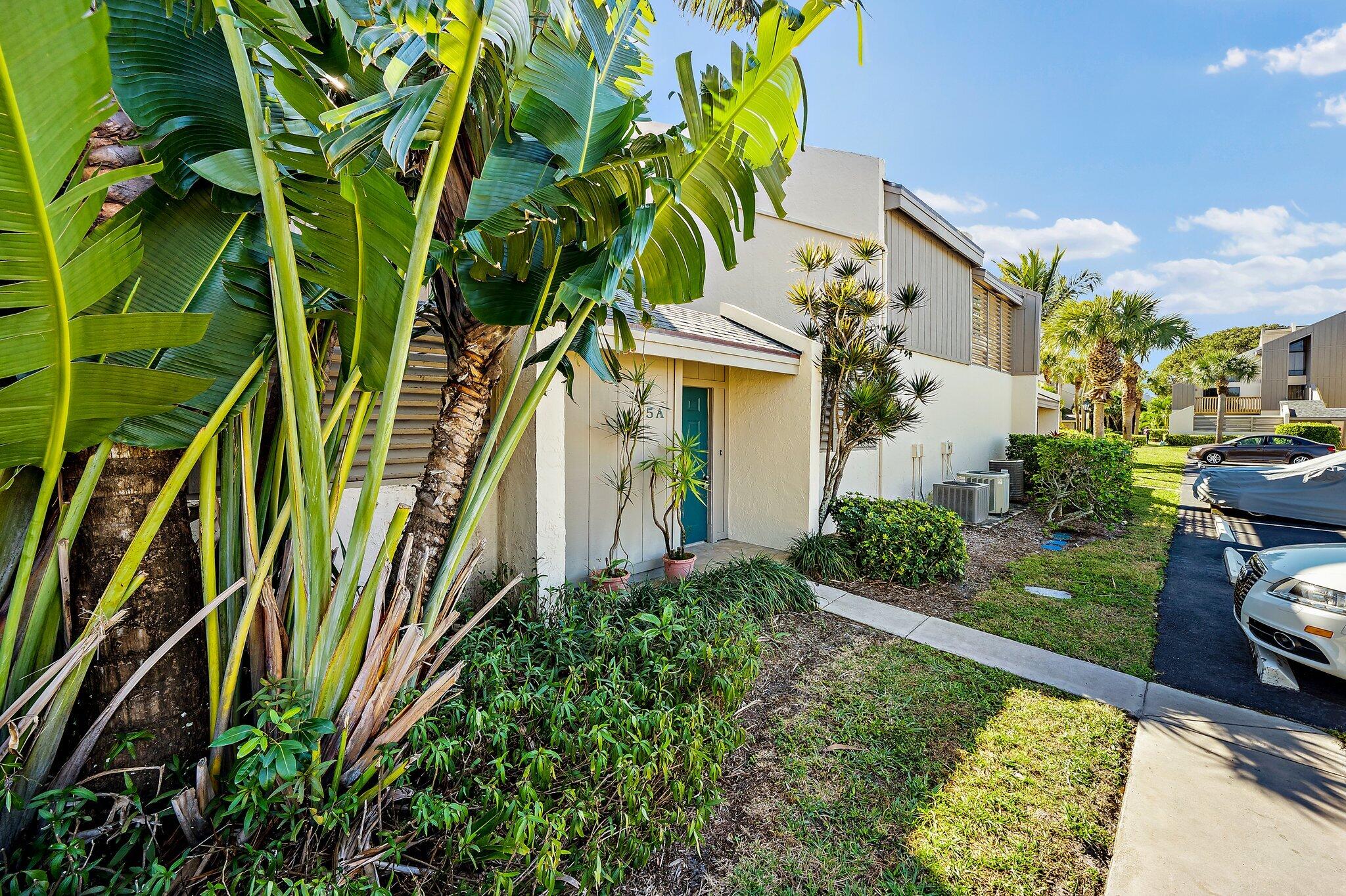 1605 Highway 1, Unit SL5A Jupiter, FL 33477 - Photo 3 of 26 a view of a yard with plants