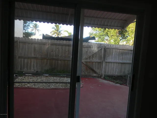 a view of outdoor space with wooden fence