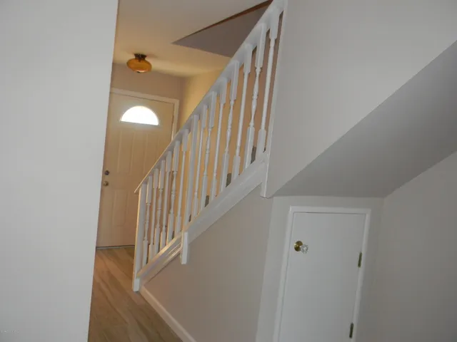 a view of entryway with wooden floor