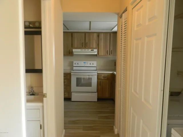 a kitchen with stainless steel appliances a refrigerator and a stove