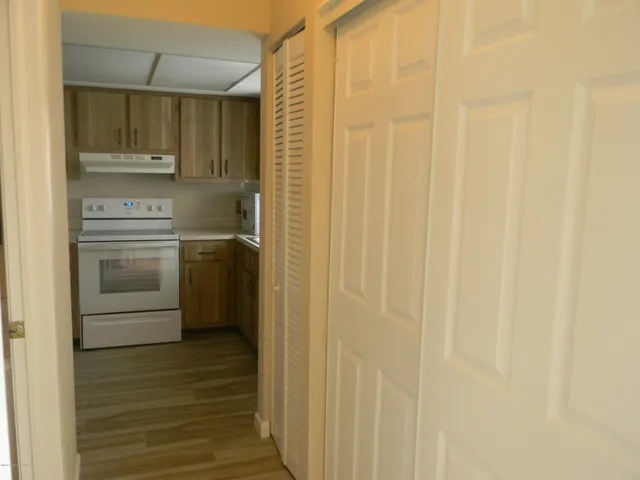 a kitchen with a stove and a refrigerator