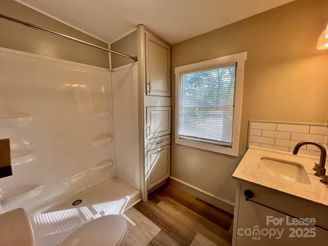 a view of a balcony with wooden floor