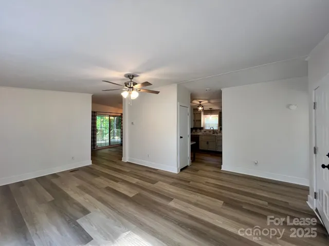 a view of a livingroom with wooden floor