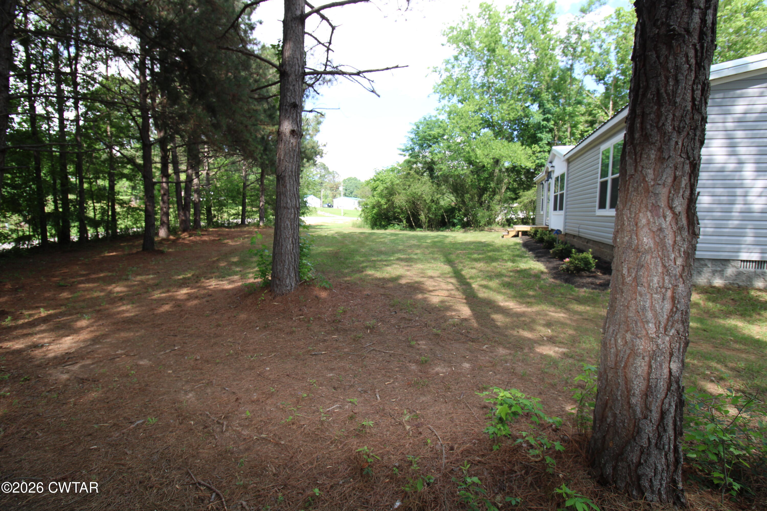 398 Pope Road Lexington, TN 38351 - Photo 21 of 21 a view of a house with backyard