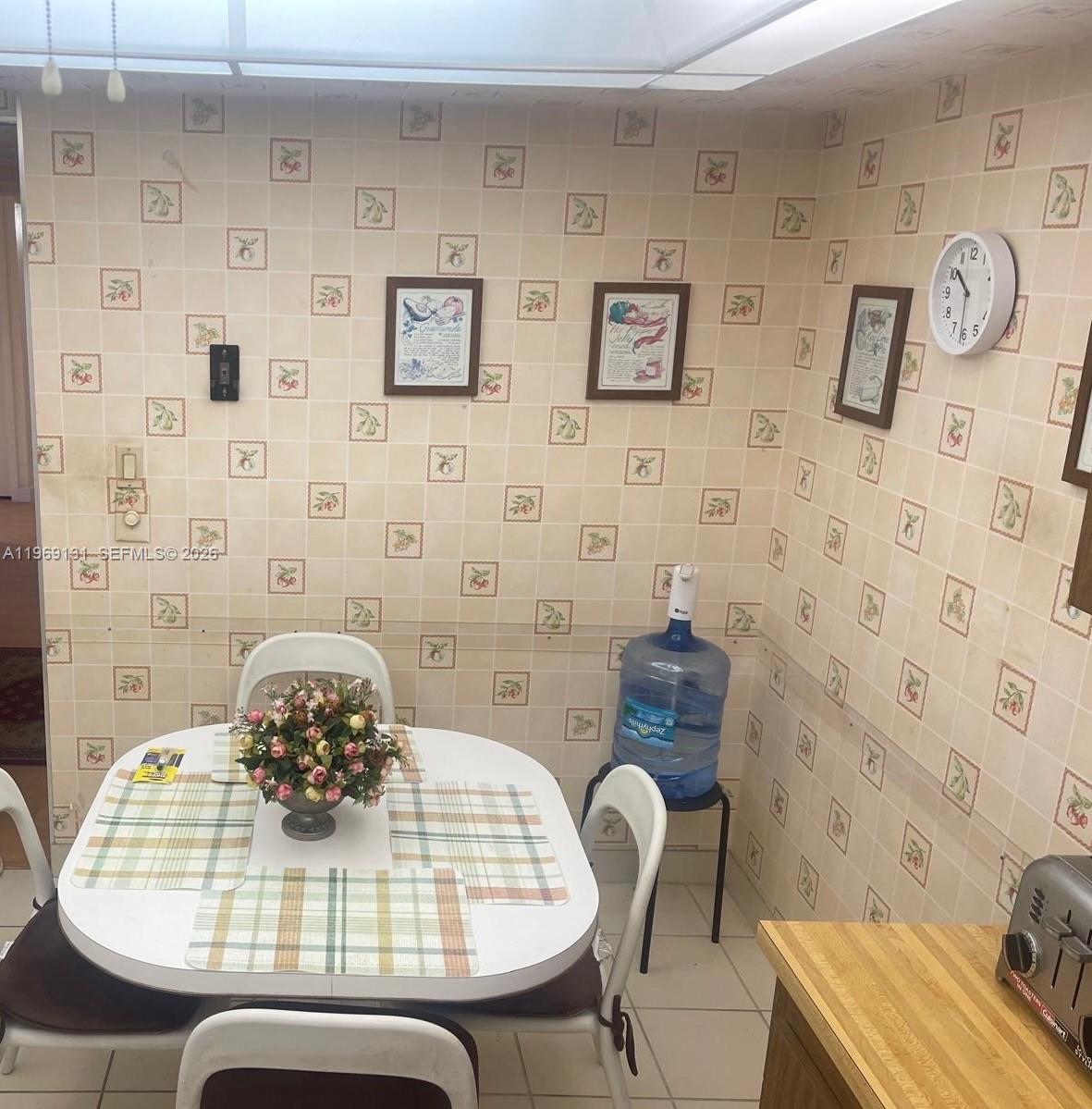 16500 Golf Club Road, Unit 204 Weston, FL 33326 - Photo 13 of 26 a view of a dining room with furniture and wooden floor