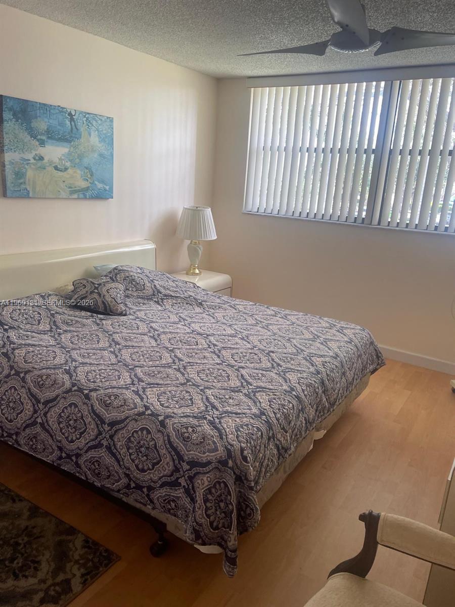16500 Golf Club Road, Unit 204 Weston, FL 33326 - Photo 15 of 26 a bedroom with a bed and a window