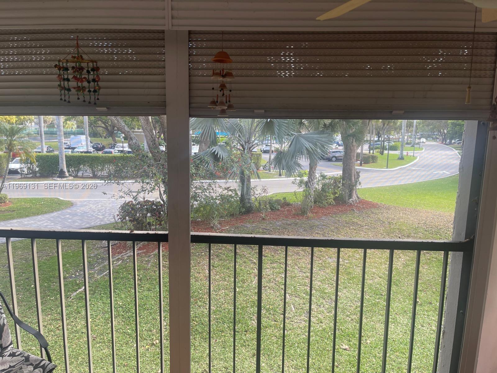 16500 Golf Club Road, Unit 204 Weston, FL 33326 - Photo 20 of 26 a view of a glass building from a window