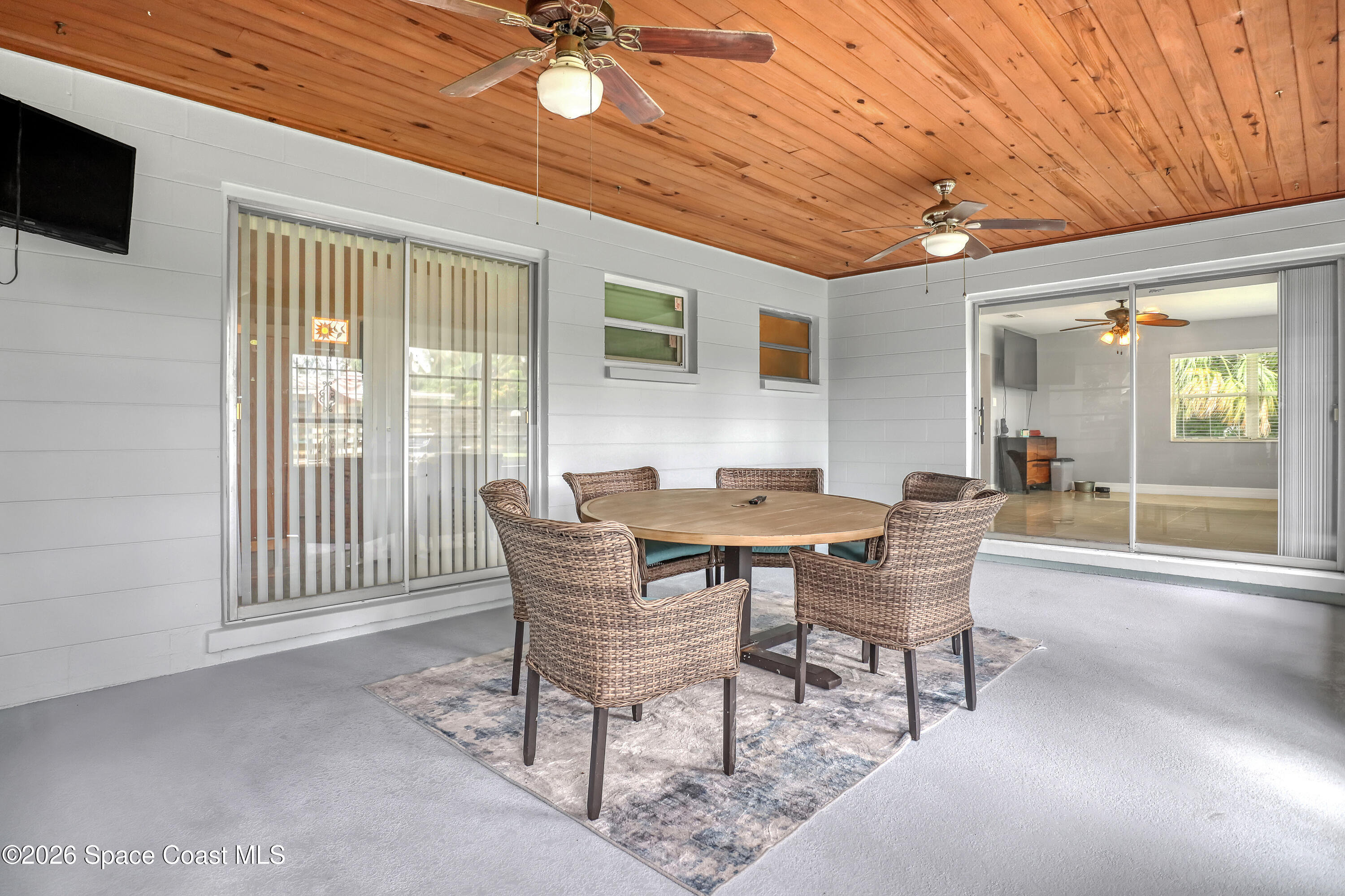 2307 Country Club Road Melbourne, FL 32901 - Photo 28 of 44 a dining room with furniture and window