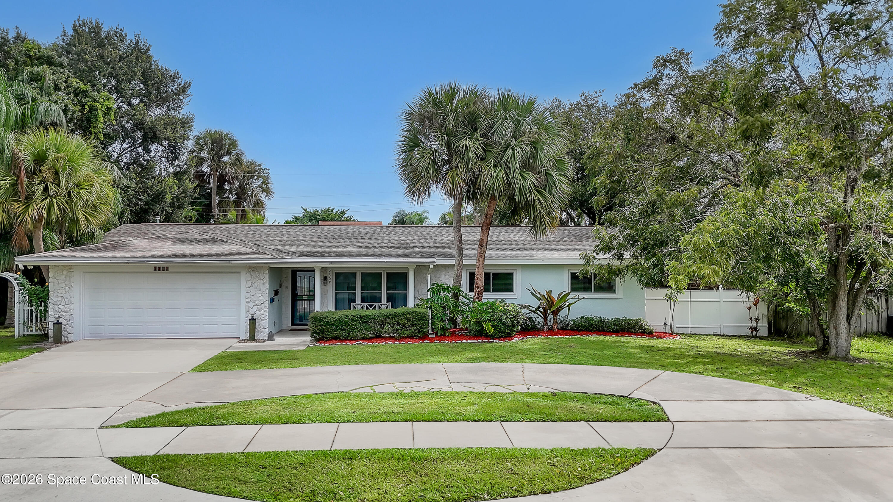 2307 Country Club Road Melbourne, FL 32901 - Photo 8 of 44 a front view of house with yard and green space