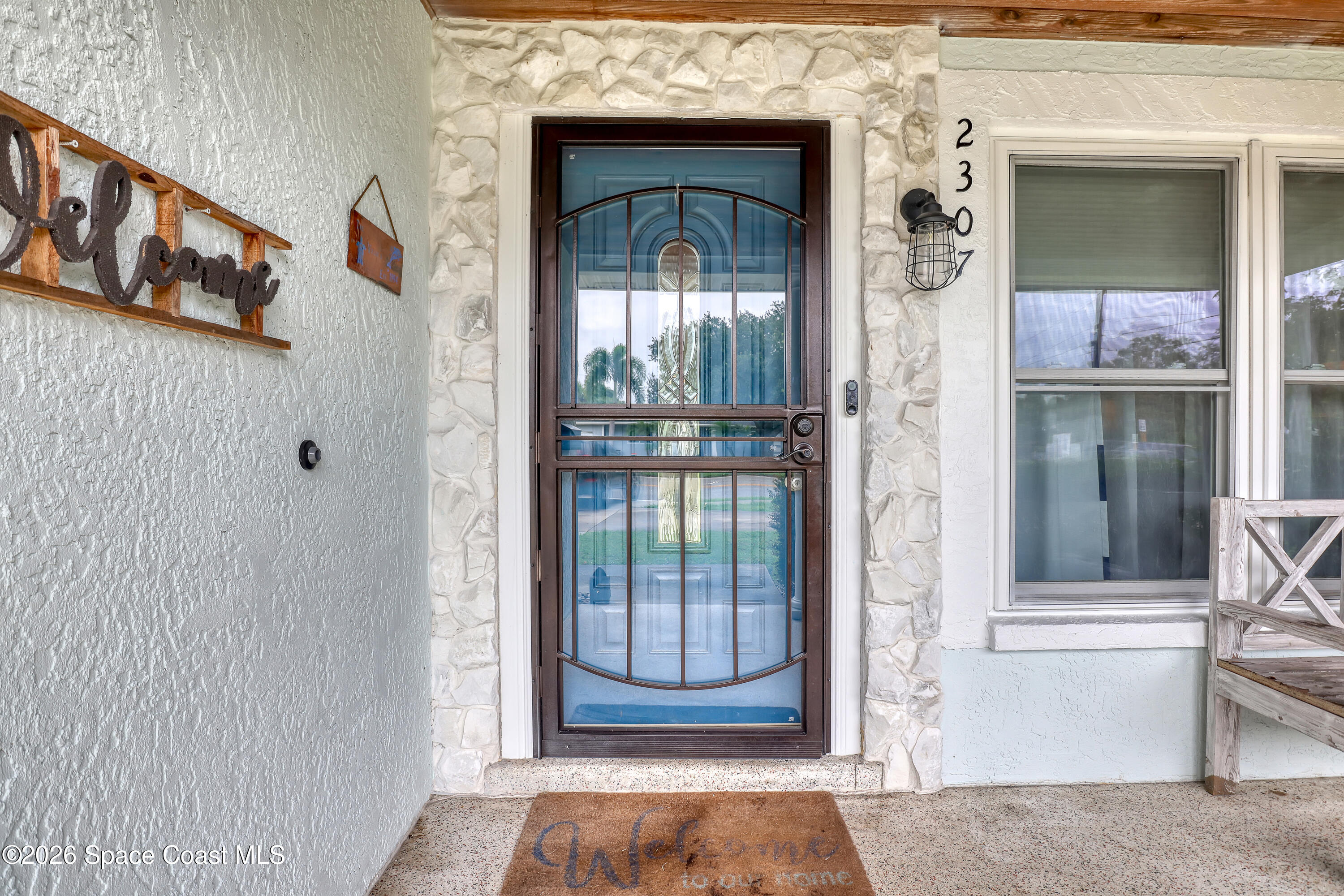 2307 Country Club Road Melbourne, FL 32901 - Photo 9 of 44 a view of front door of a house