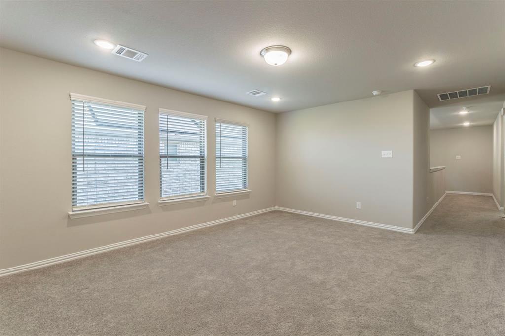 626 Ruthye Lane Pilot Point, TX 76258 - Photo 18 of 27 Upstairs bonus room featuring light carpet and recessed lighting